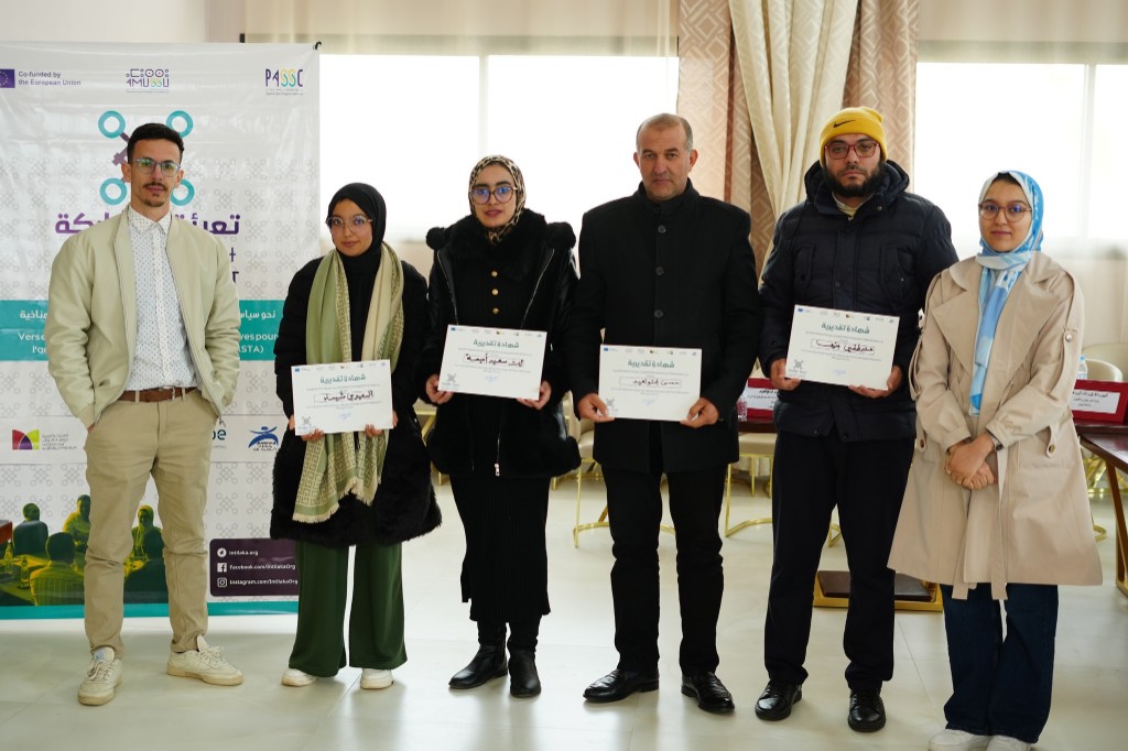 Participants with certificates of appreciation
