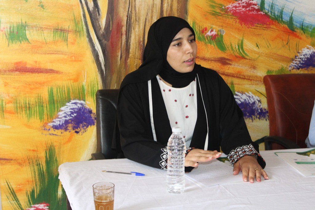Participant speaking during the meeting in Had Bouhssousen